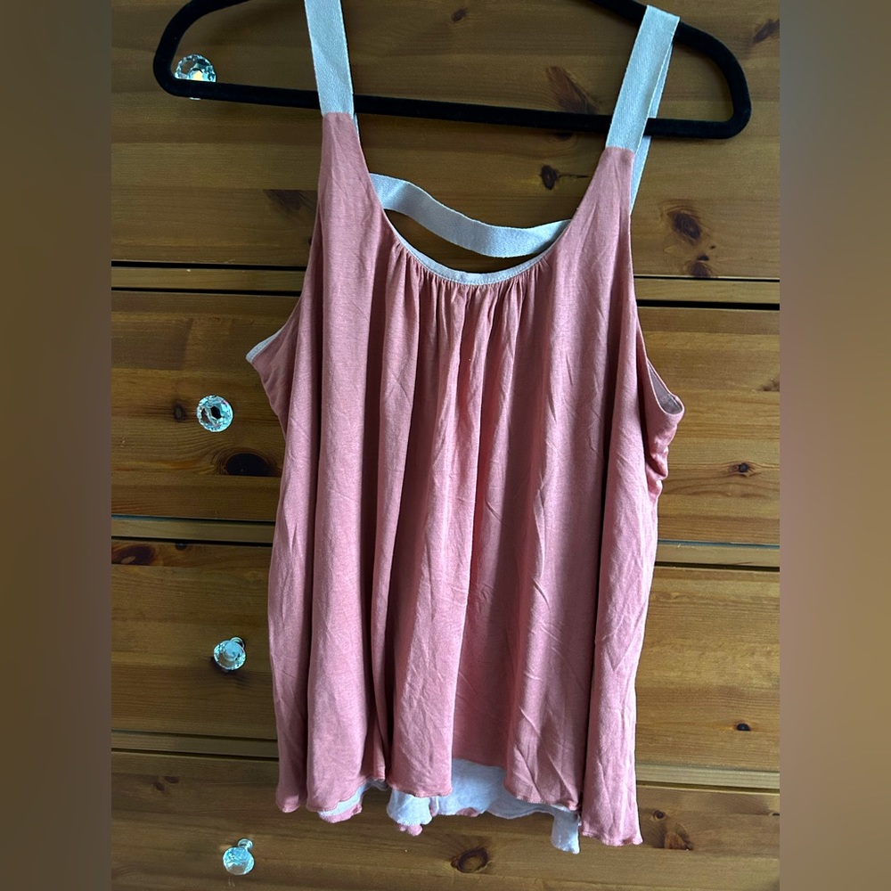 Sleeveless swing style top. Two toned